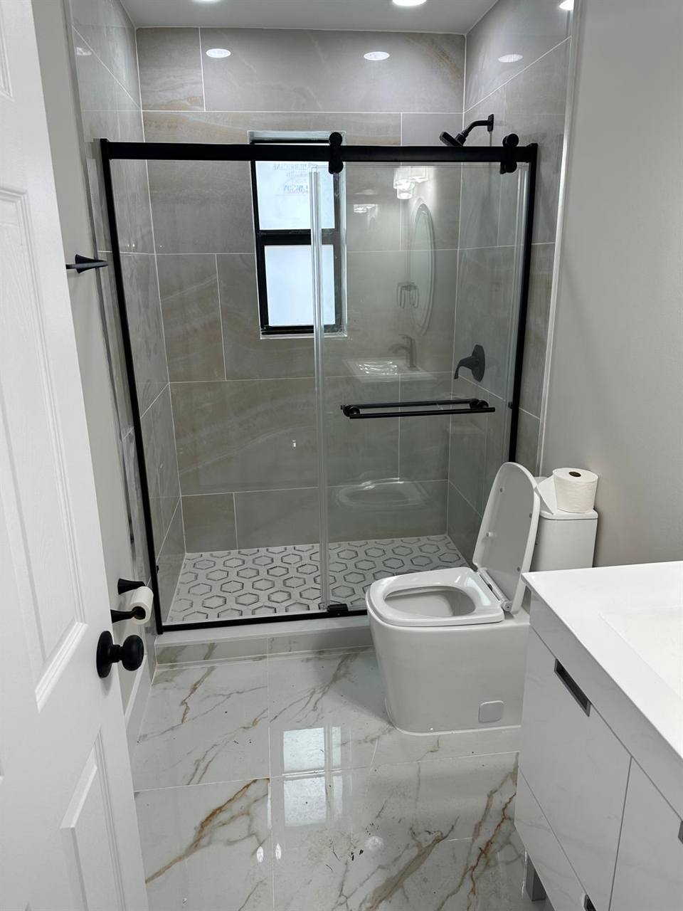 Bathroom glass door gray tile