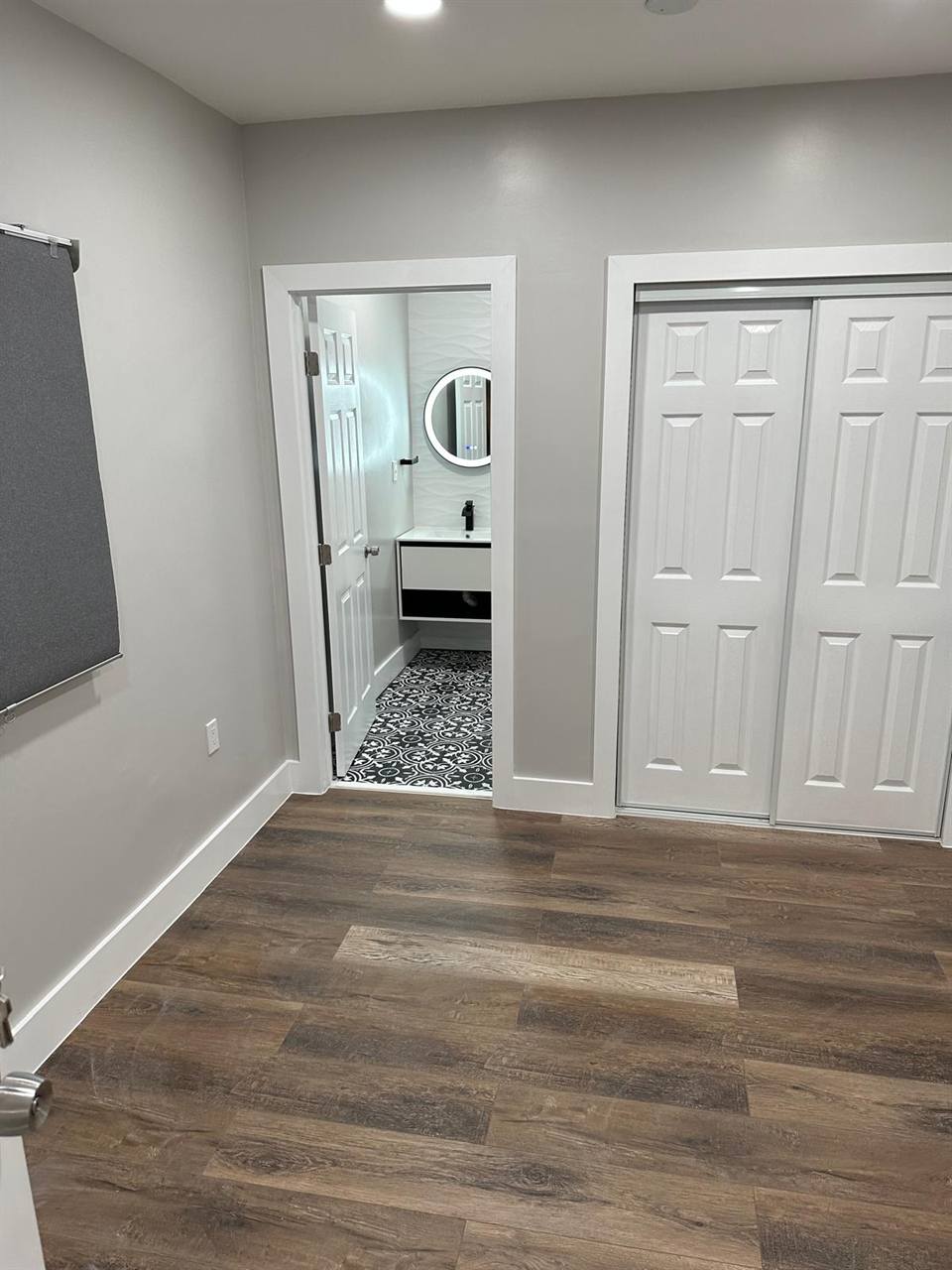 Wood-look flooring with bathroom view