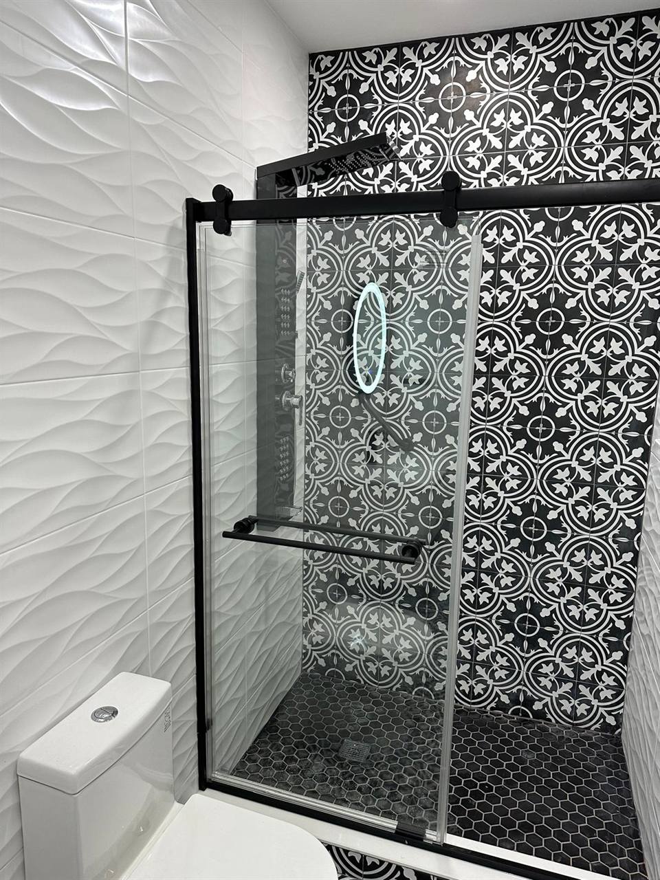 Shower black white cement tiles glass door