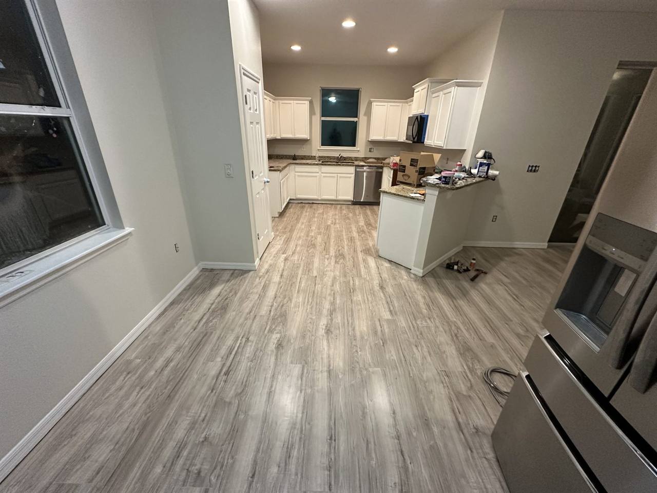 Kitchen white cabinets wood flooring renovation