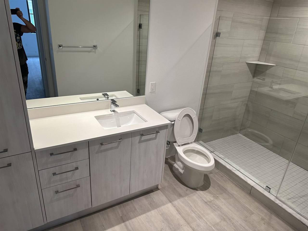 Bathroom modern vanity glass shower gray tile