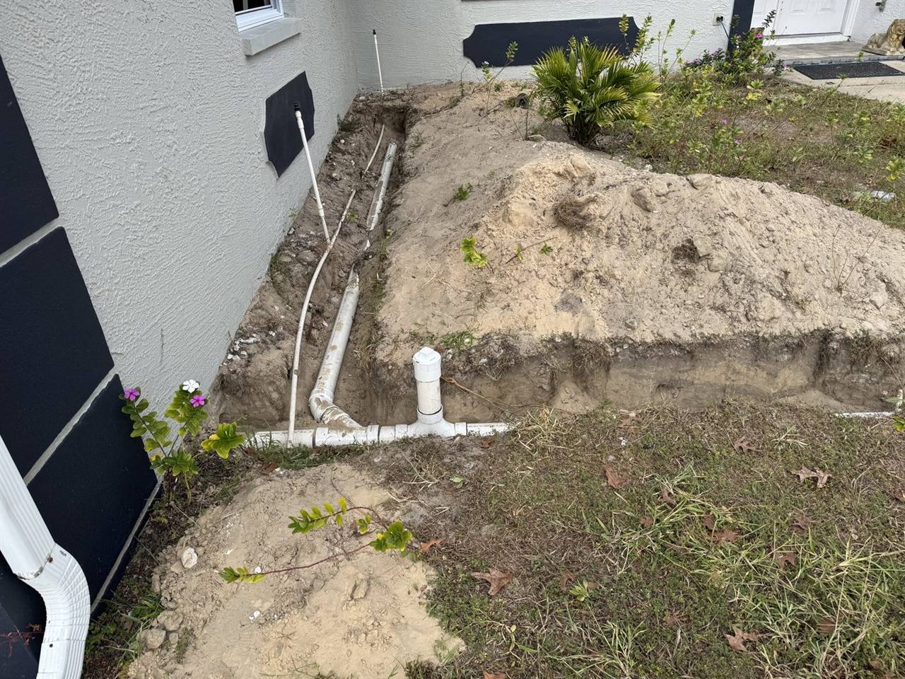 Exterior plumbing drainage installation